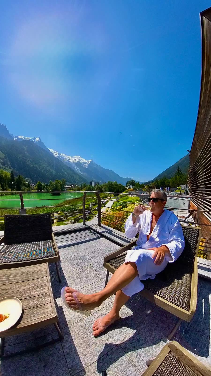 Munny relaxing on a terrace with Mont Blanc behind